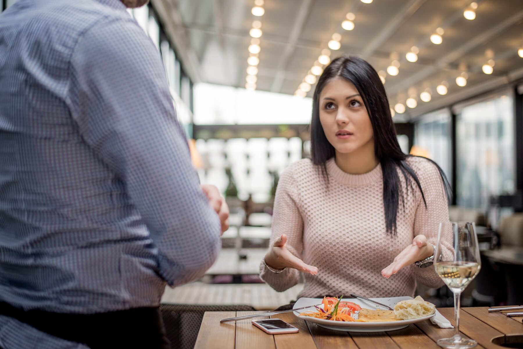 portrait-of-woman-complaining-about-food-quality-and-taste-in